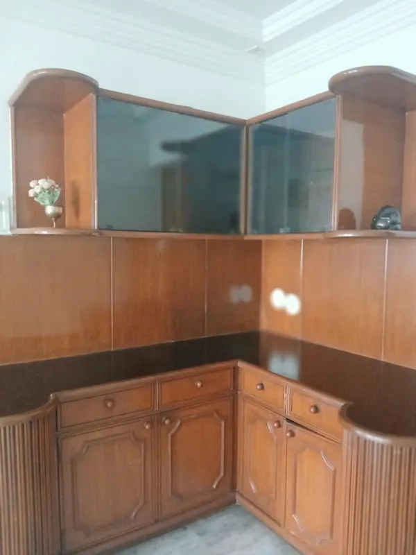 Corner crockery and display unit with storage in the hall, City Light, Surat
