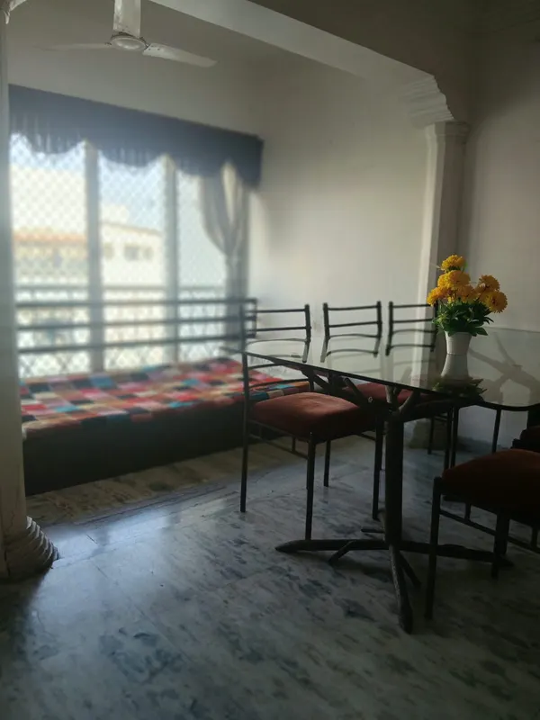 Dining area with window seating next to the hall, City Light, Surat