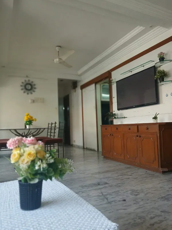 View across the hall towards the TV unit and dining area, City Light, Surat